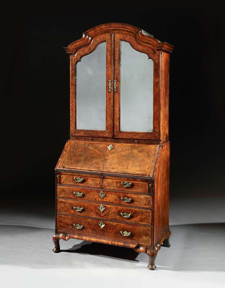 A GEORGE I WALNUT BUREAU CABINET ON CABRIOLE LEGS